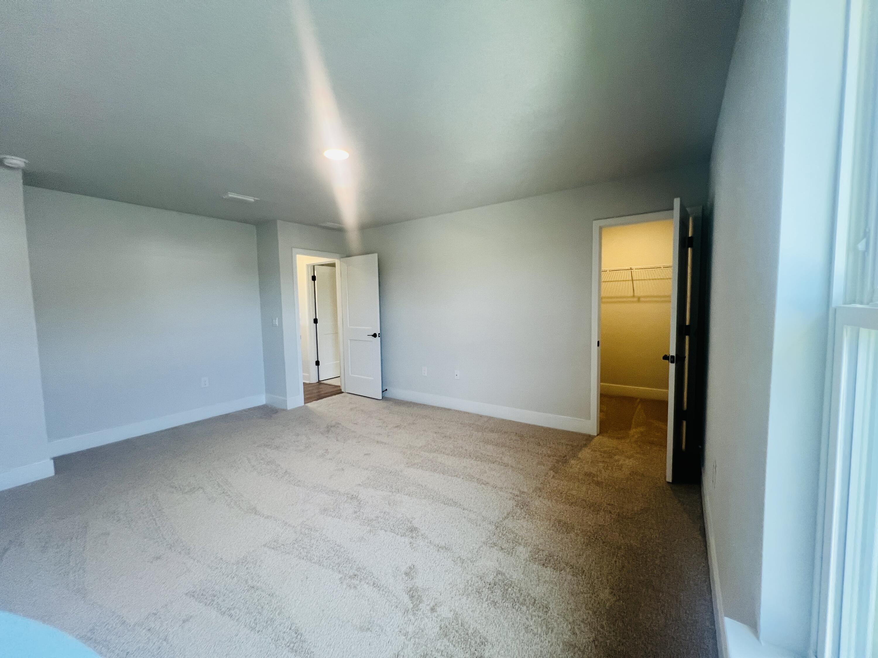 5299 Hidden Pines Circle Milton, FL 32583 - Photo 32 of 33 a view of an empty room and a window