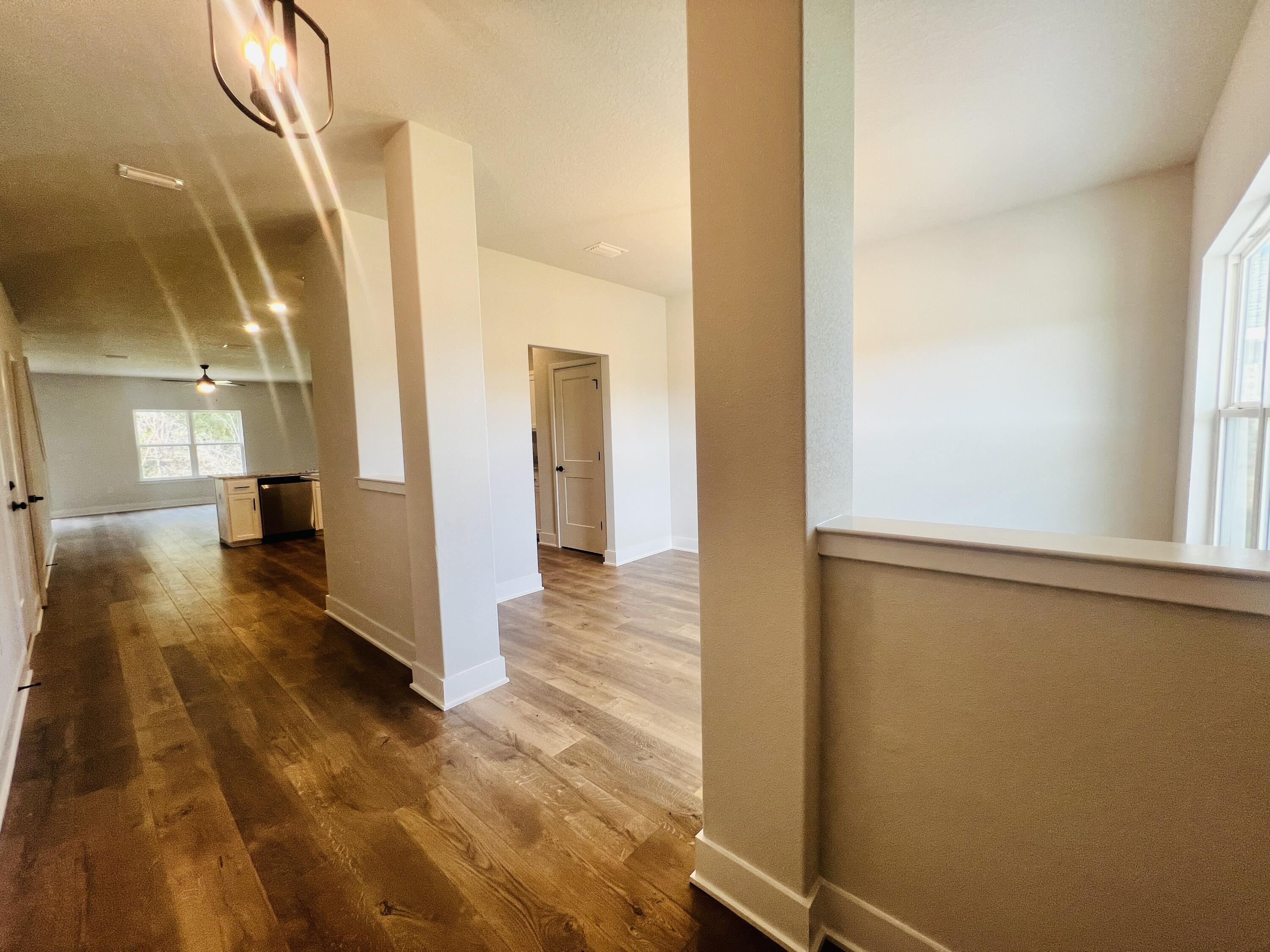 5299 Hidden Pines Circle Milton, FL 32583 - Photo 5 of 33 a view of hallway with wooden floor