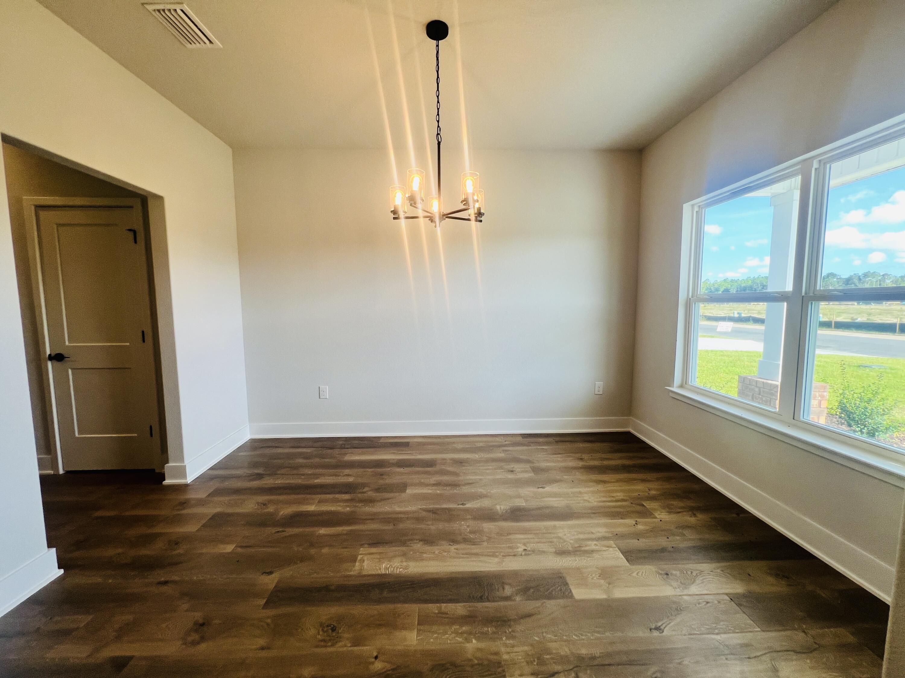 5299 Hidden Pines Circle Milton, FL 32583 - Photo 6 of 33 a view of an empty room with a window