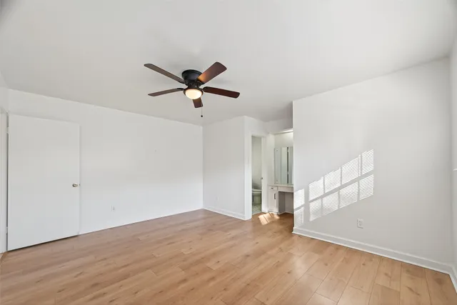 a bathroom with a toilet a sink and shower