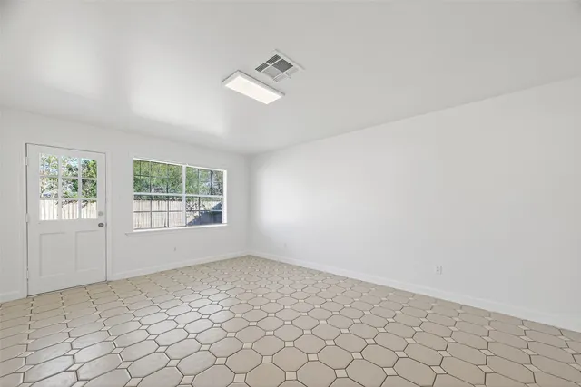 an empty room with windows