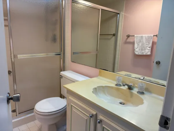 a bathroom with a sink toilet and shower