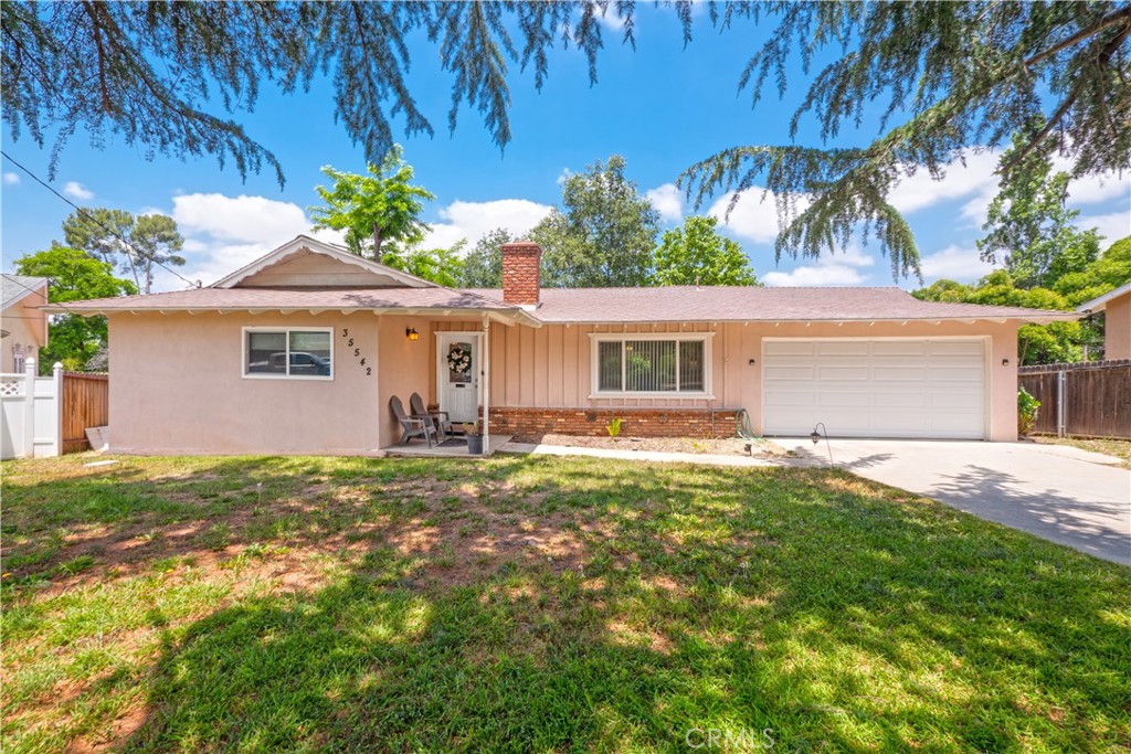 35542 Rodeo Road Yucaipa, CA 92399 - Photo 1 of 1 front view of a house with a yard