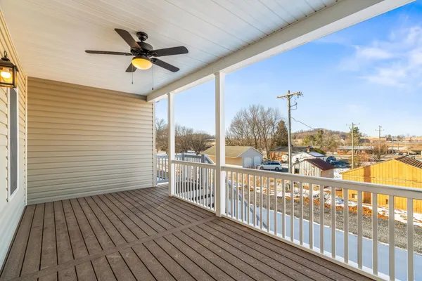 a view of a balcony with wooden floor