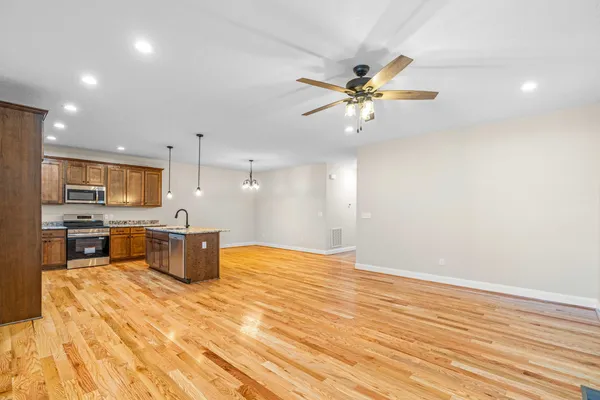 a view of a kitchen with a sink and microwave
