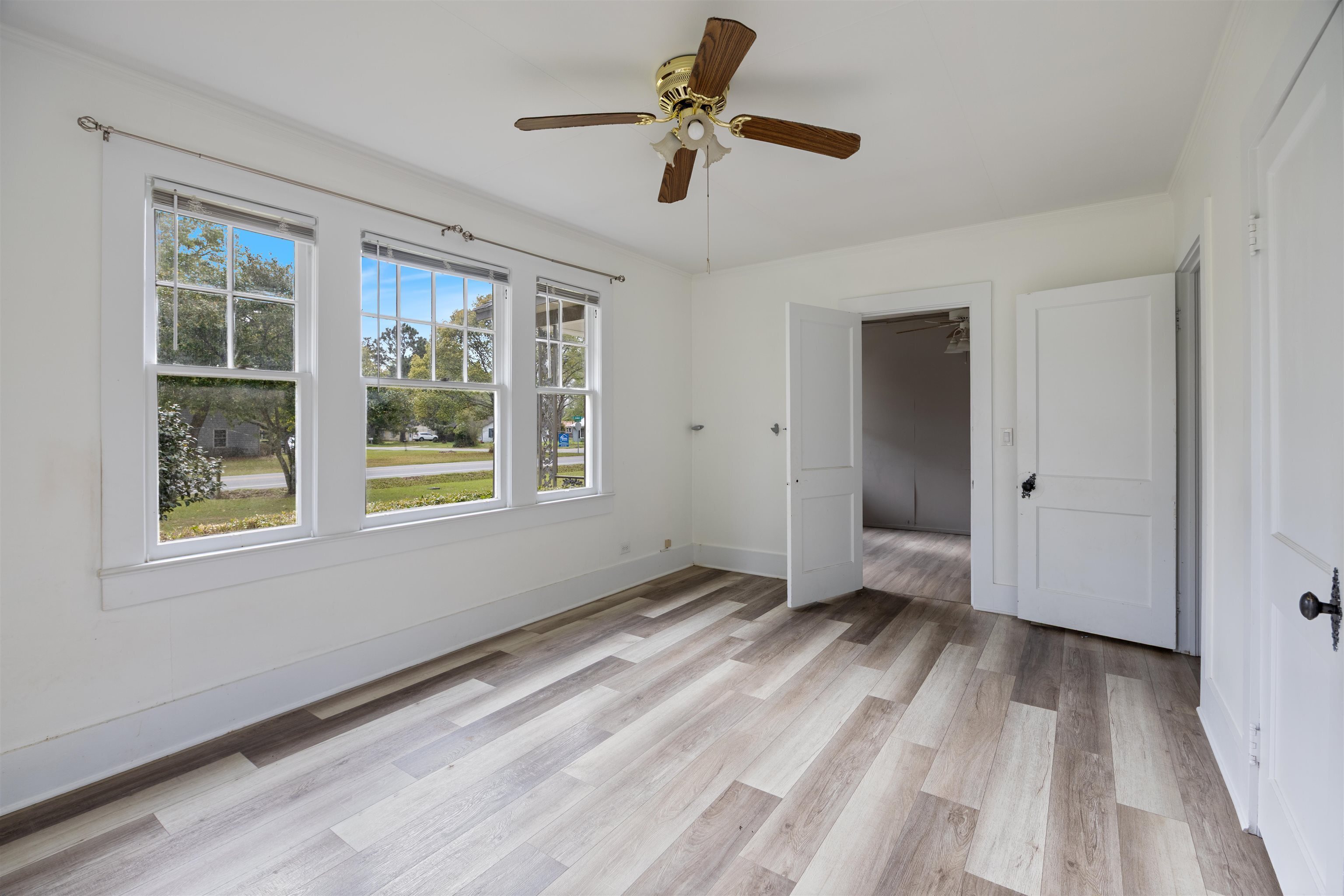 112 South Juniper Street Foley, AL 36535 - Photo 45 of 64 Unfurnished bedroom with light wood-style flooring and a ceiling fan