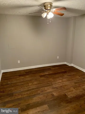 a view of room with wooden floor