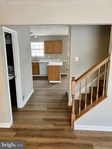 a view of a living room with wooden floor