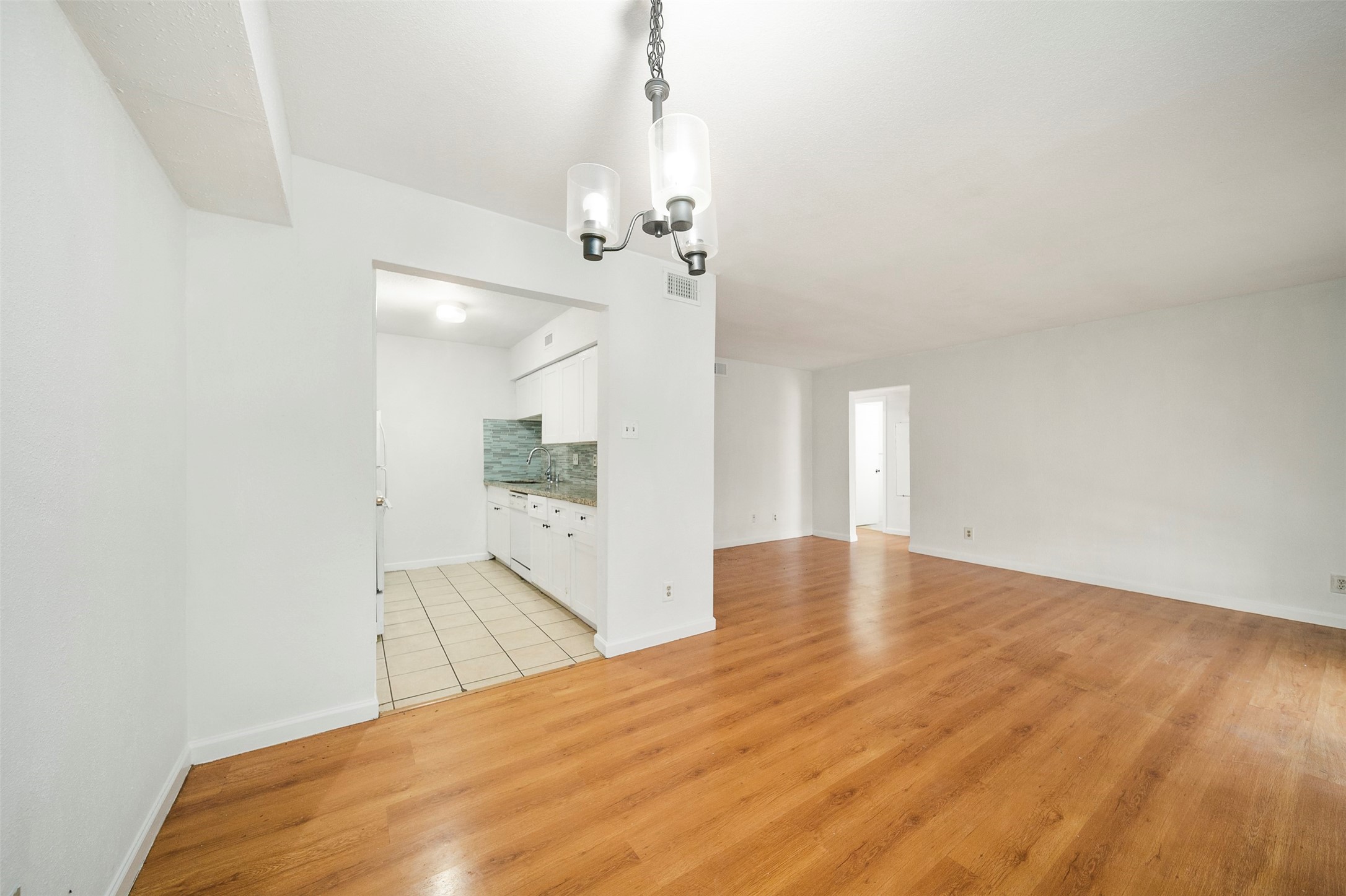 6201 Ranchester Drive, Unit 36 Houston, TX 77036 - Photo 1 of 23 a view of empty room with wooden floor