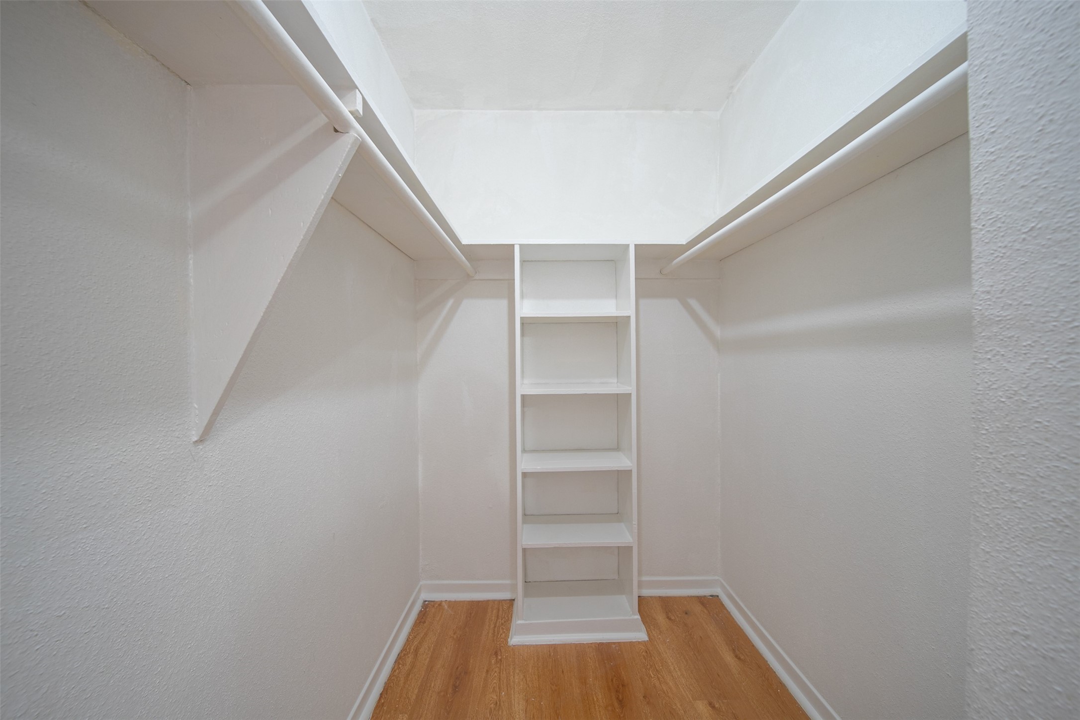 6201 Ranchester Drive, Unit 36 Houston, TX 77036 - Photo 13 of 23 a view of walk in closet with empty racks