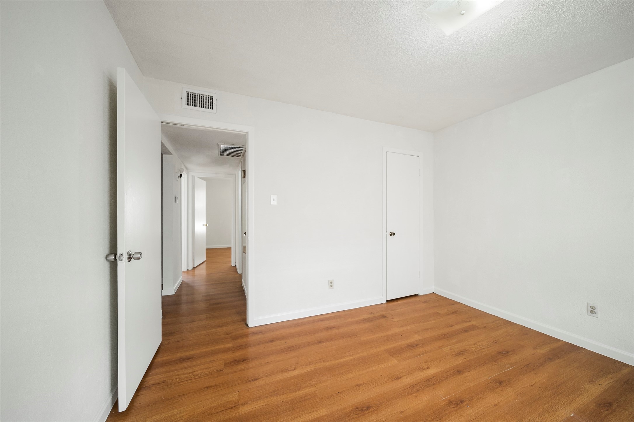 6201 Ranchester Drive, Unit 36 Houston, TX 77036 - Photo 15 of 23 a view of a big room with wooden floor and closet
