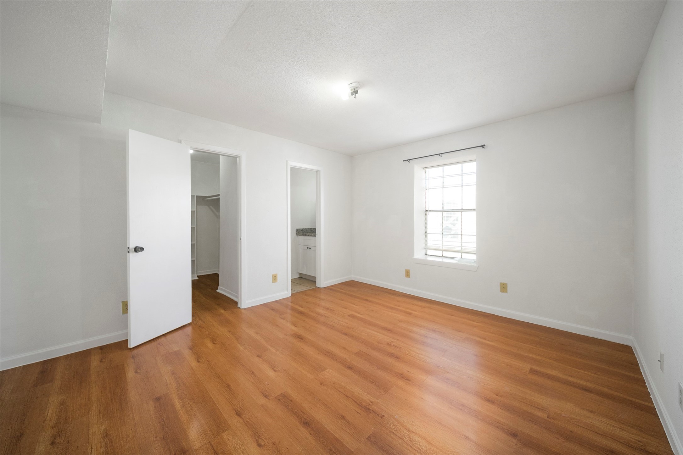 6201 Ranchester Drive, Unit 36 Houston, TX 77036 - Photo 19 of 23 a view of empty room with wooden floor and fan