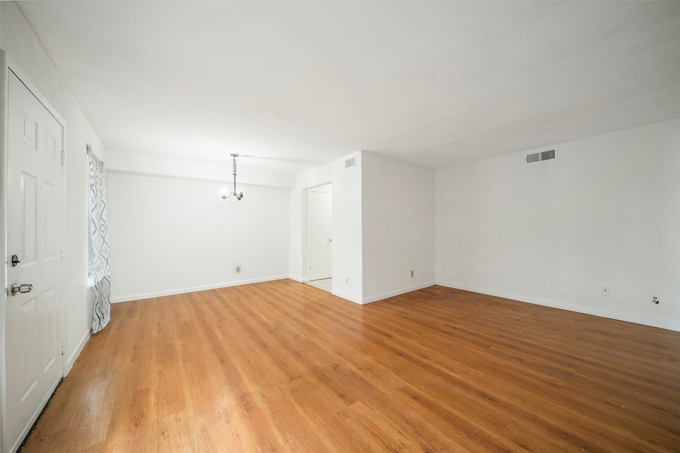 6201 Ranchester Drive, Unit 36 Houston, TX 77036 - Photo 5 of 23 a view of empty room with wooden floor and fan