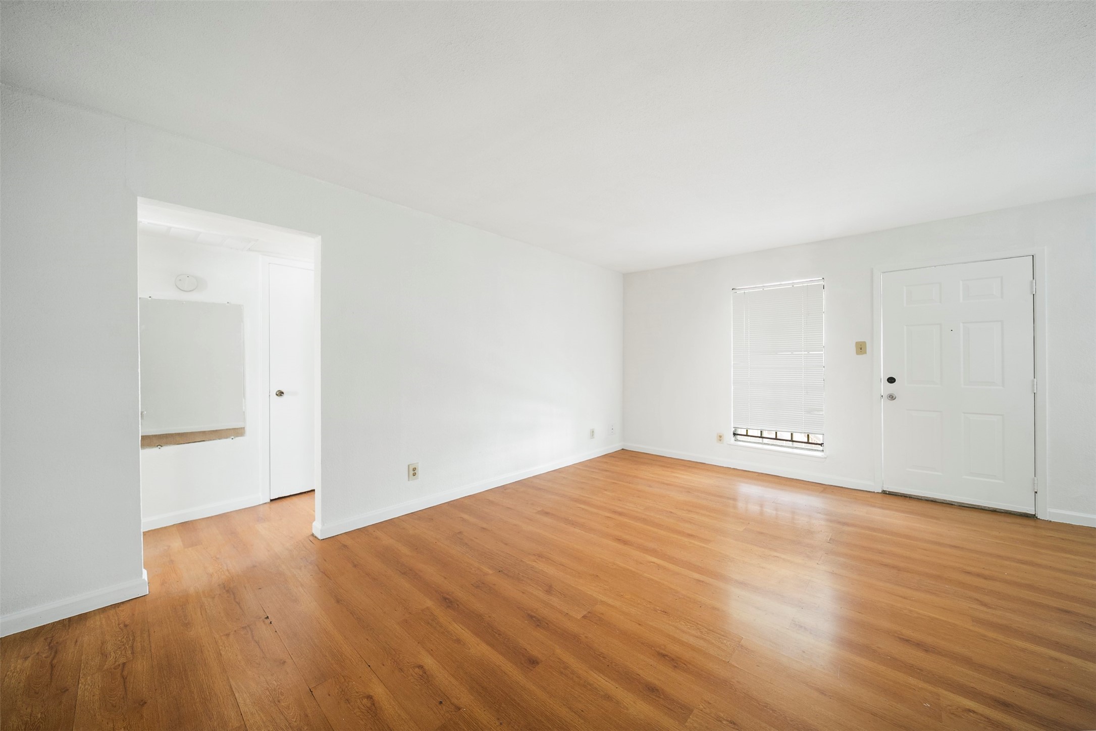 6201 Ranchester Drive, Unit 36 Houston, TX 77036 - Photo 6 of 23 a view of empty room with wooden floor
