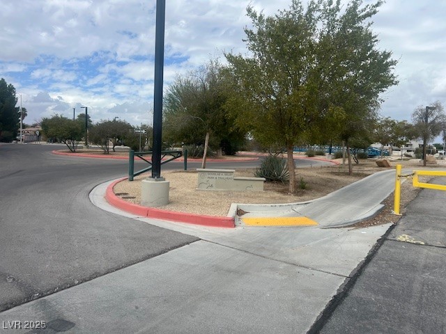 951 North Sandhill Road Las Vegas, NV 89110 - Photo 4 of 7 View of asphalt street with curbs, sidewalks, and street lights