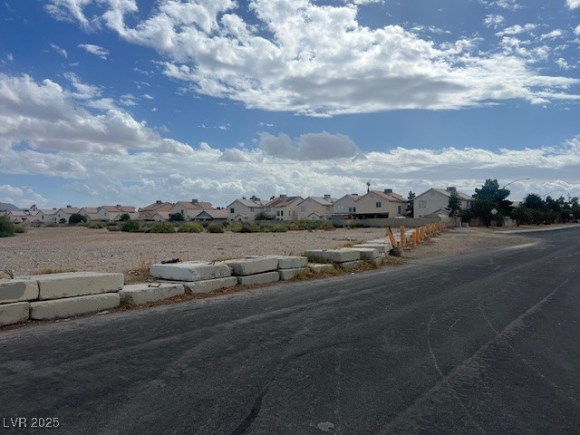 951 North Sandhill Road Las Vegas, NV 89110 - Photo 6 of 7 View of asphalt road featuring a residential view