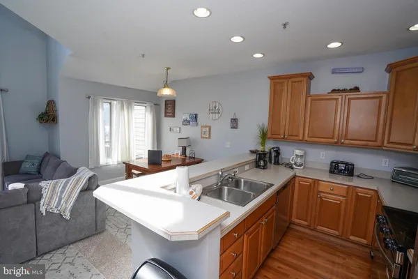 a bedroom with a bed and a flat tv screen on dresser