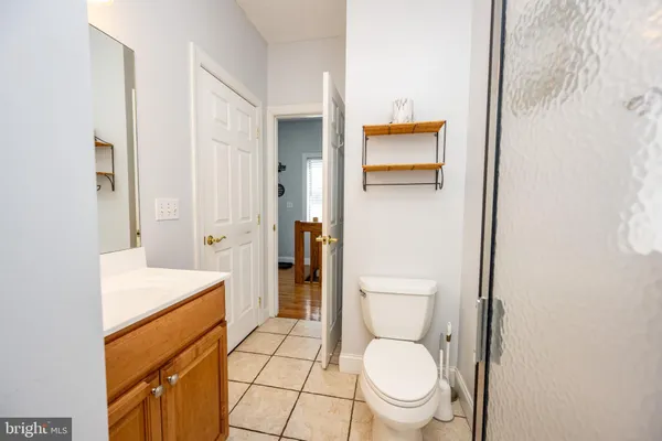 a bedroom with a bed and a table in it