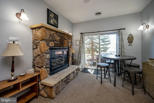 a view of a livingroom with furniture and window