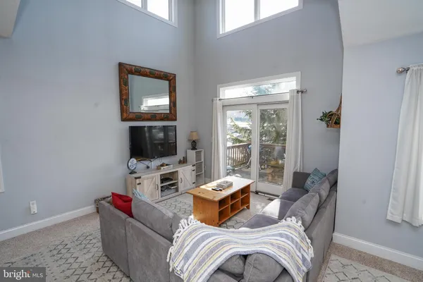 a kitchen with refrigerator a sink a stove and cabinets
