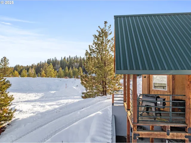 a balcony with table and chairs