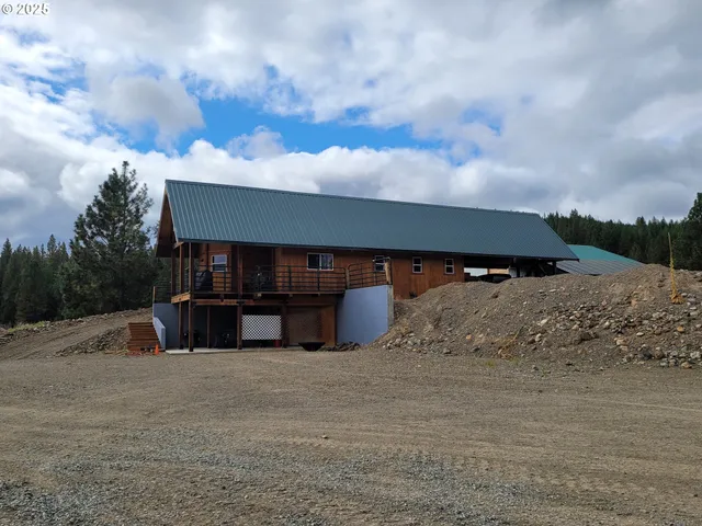 a kitchen with stainless steel appliances granite countertop a refrigerator and a stove