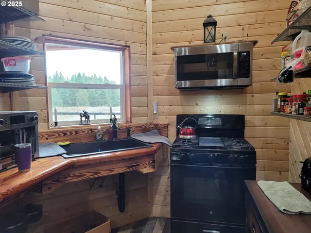 a view of a livingroom with furniture and a flat screen tv