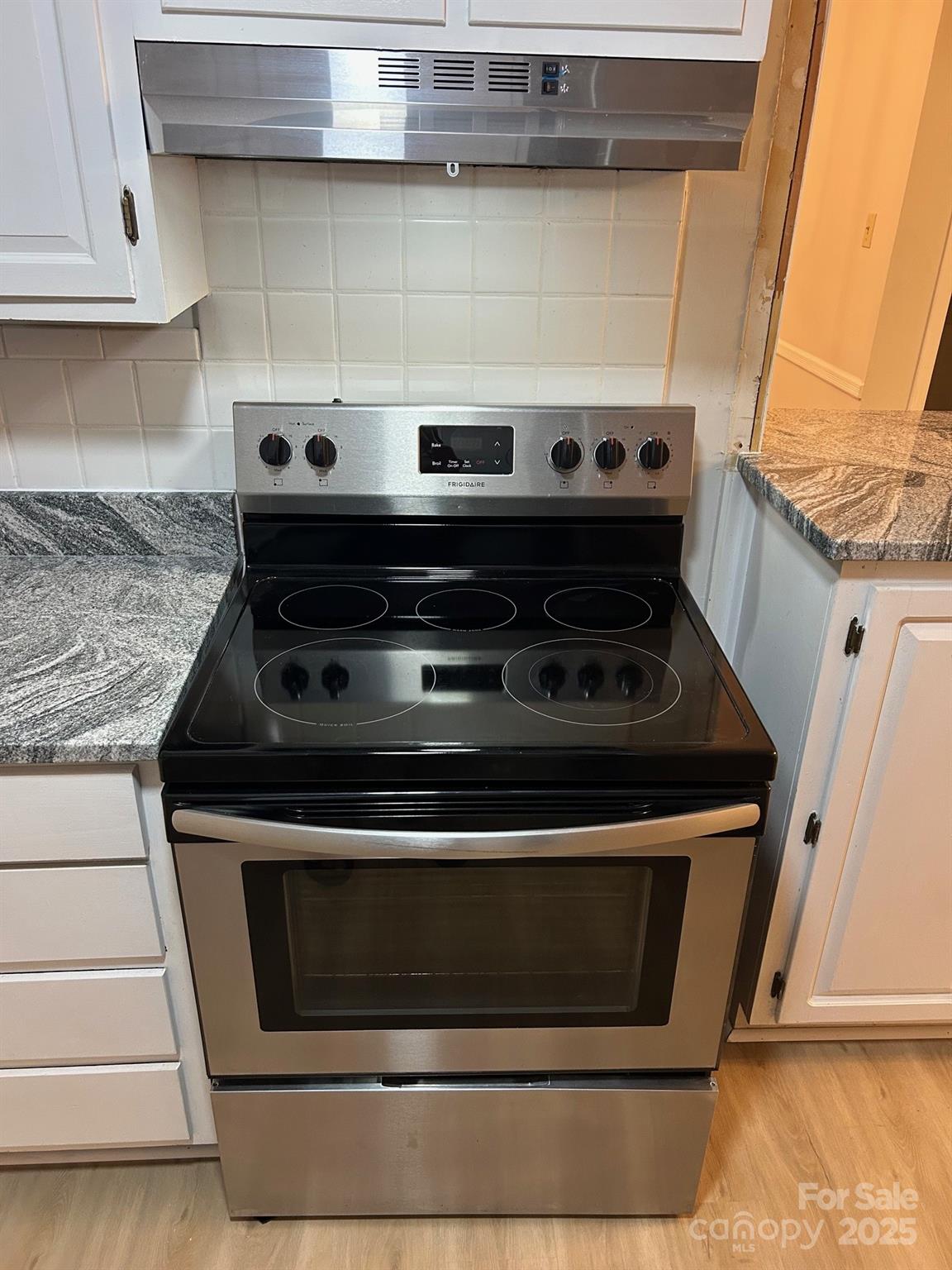 2227 Rexford Road Charlotte, NC 28211 - Photo 18 of 31 a stove top oven sitting inside of a kitchen