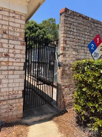 a swimming pool with outdoor seating and plants