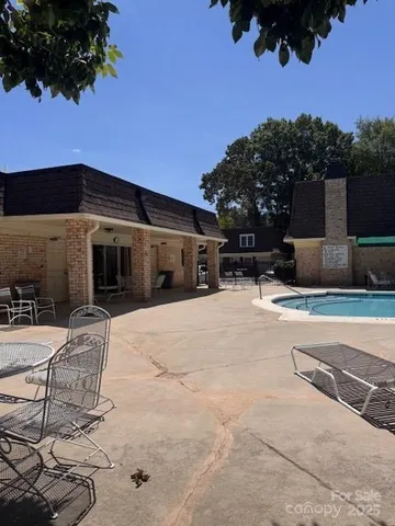 a view of a pathway with a wrought fence