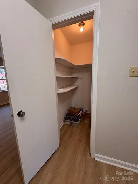2227 Rexford Road Charlotte, NC 28211 - Photo 7 of 31 a view of a closet area with wooden floor