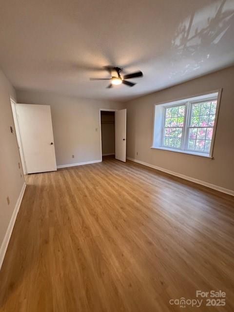 2227 Rexford Road Charlotte, NC 28211 - Photo 9 of 31 an empty room with windows and ceiling fan