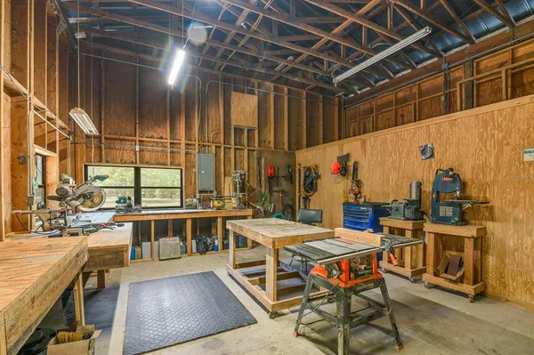 a kitchen with a table and chairs in it