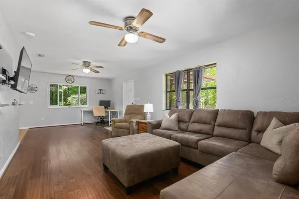 a living room with furniture and a window