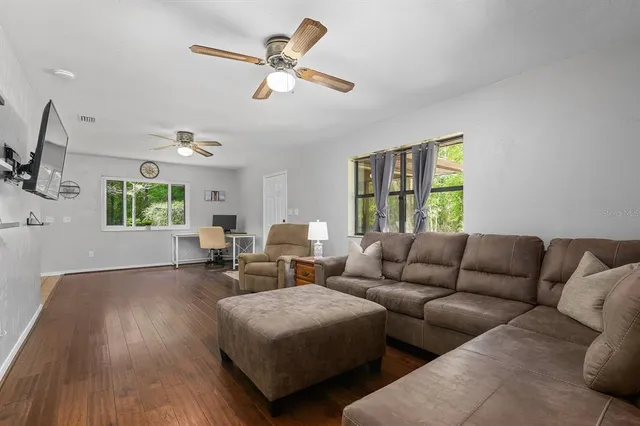 a living room with furniture and a window