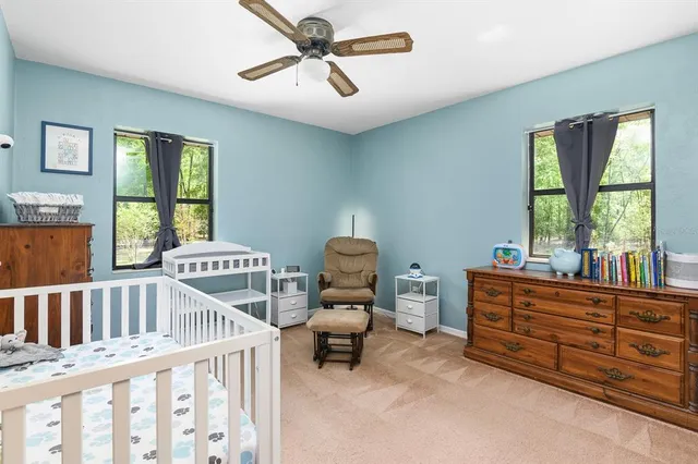 a bedroom with furniture and windows