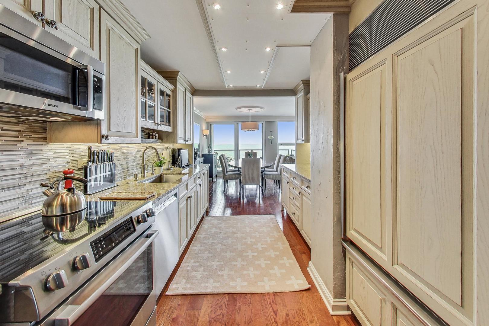 1630 Sheridan Road, Unit 8B Wilmette, IL 60091 - Photo 11 of 45 a view of a kitchen with stainless steel appliances granite countertop a lot of storage