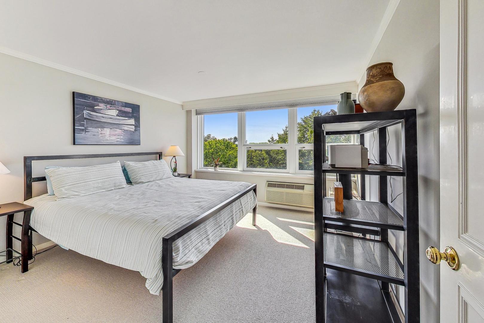 1630 Sheridan Road, Unit 8B Wilmette, IL 60091 - Photo 17 of 45 a bedroom with a bed and window