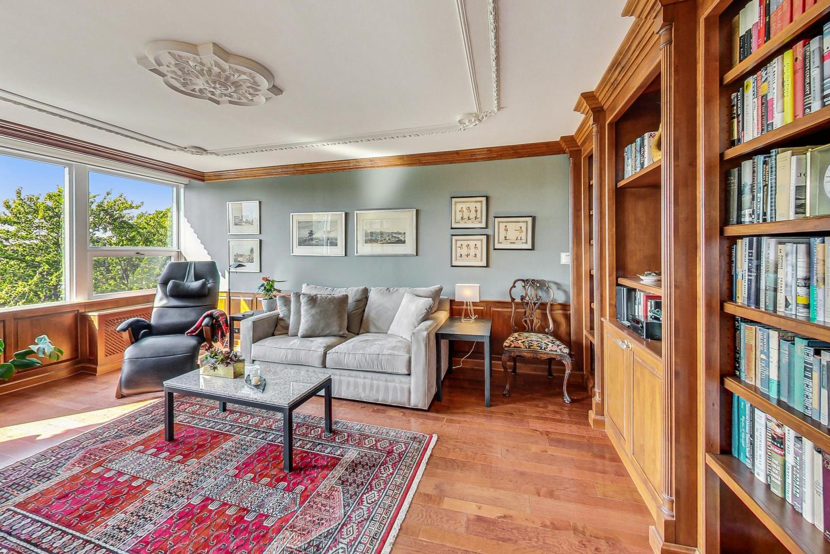 1630 Sheridan Road, Unit 8B Wilmette, IL 60091 - Photo 21 of 45 a living room with furniture a bookshelf and a window