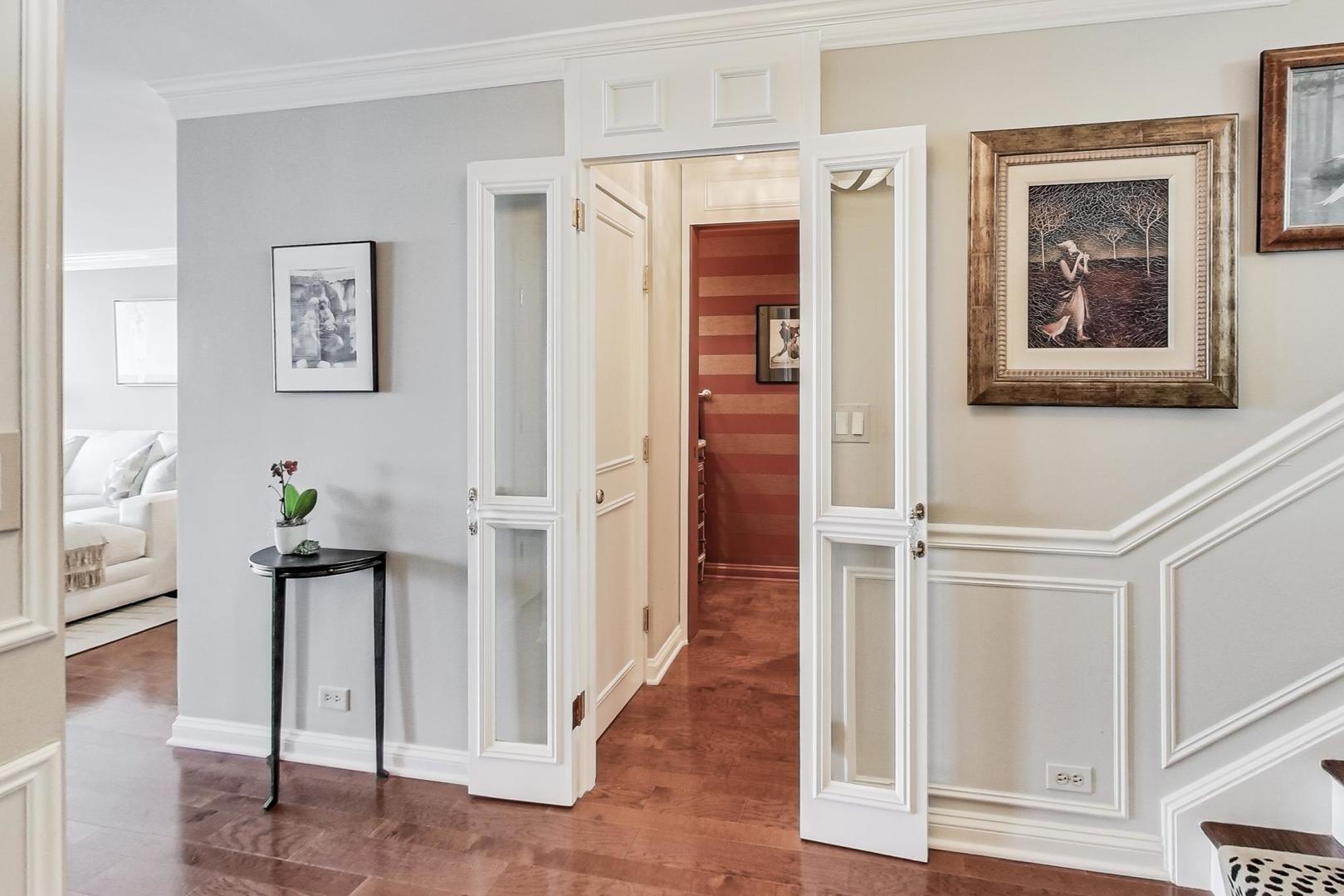 1630 Sheridan Road, Unit 8B Wilmette, IL 60091 - Photo 23 of 45 a view of hallway with wooden floor and stairs