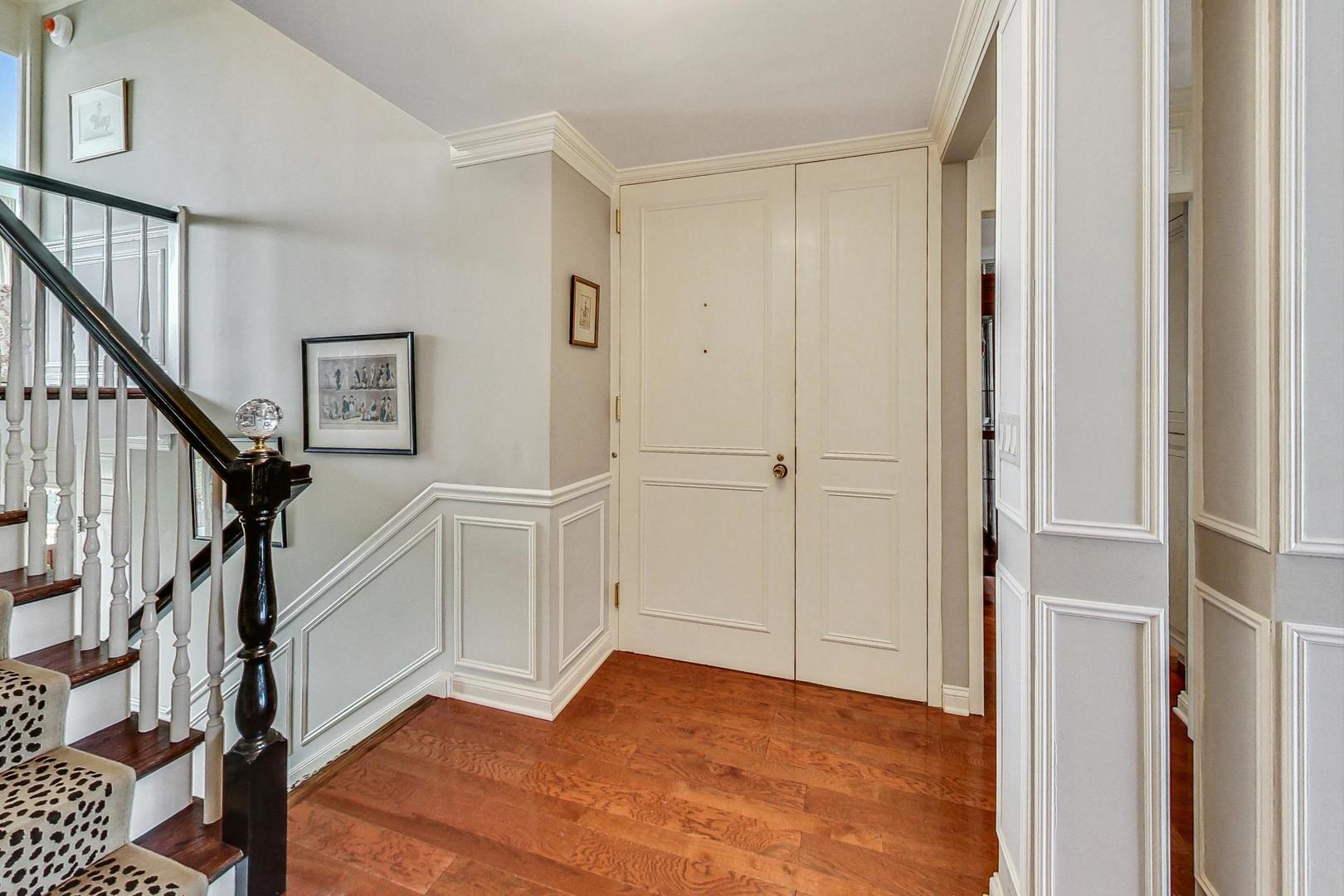 1630 Sheridan Road, Unit 8B Wilmette, IL 60091 - Photo 26 of 45 a view of a hallway with wooden floor and entryway