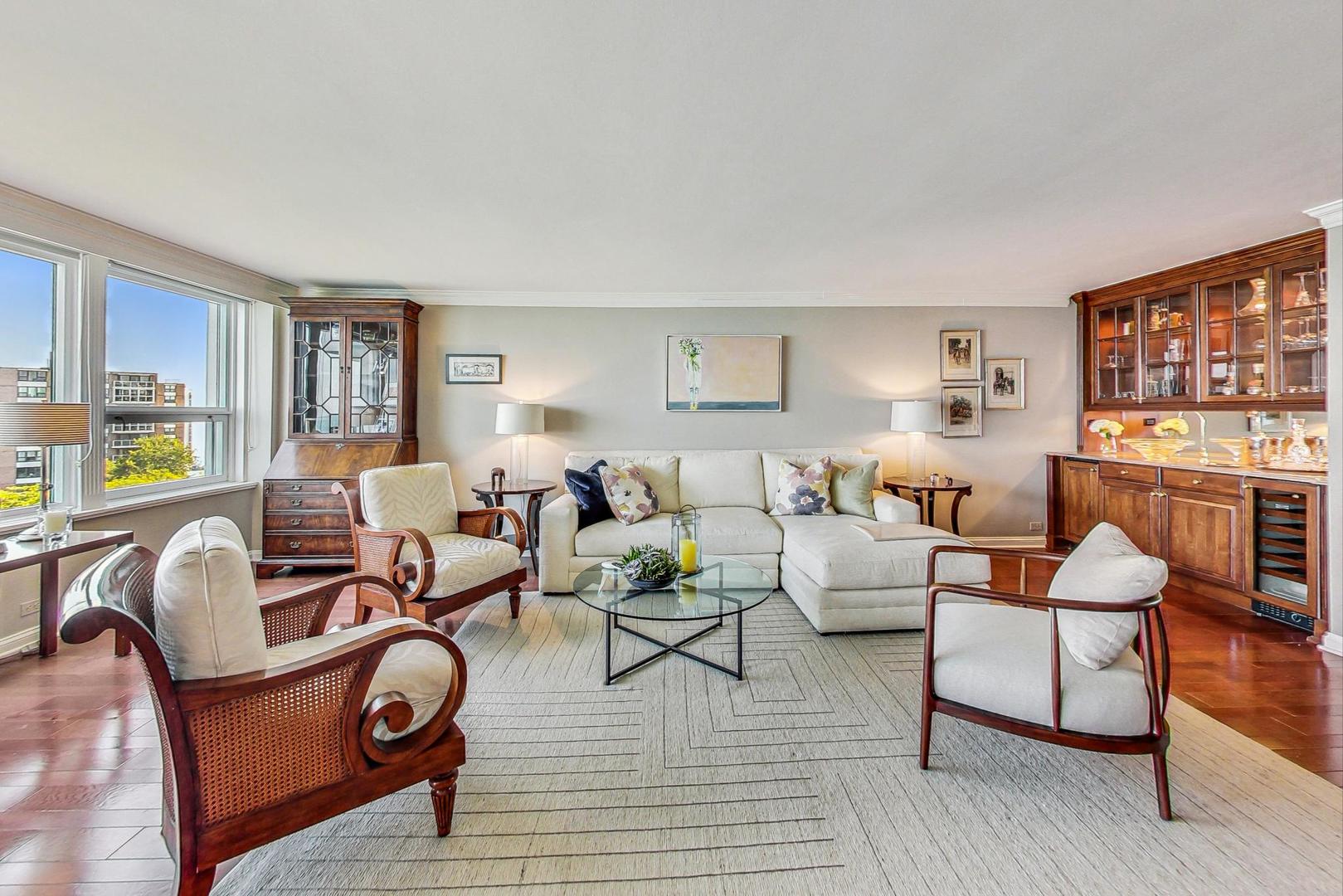 1630 Sheridan Road, Unit 8B Wilmette, IL 60091 - Photo 3 of 45 a living room with furniture and a wooden floor
