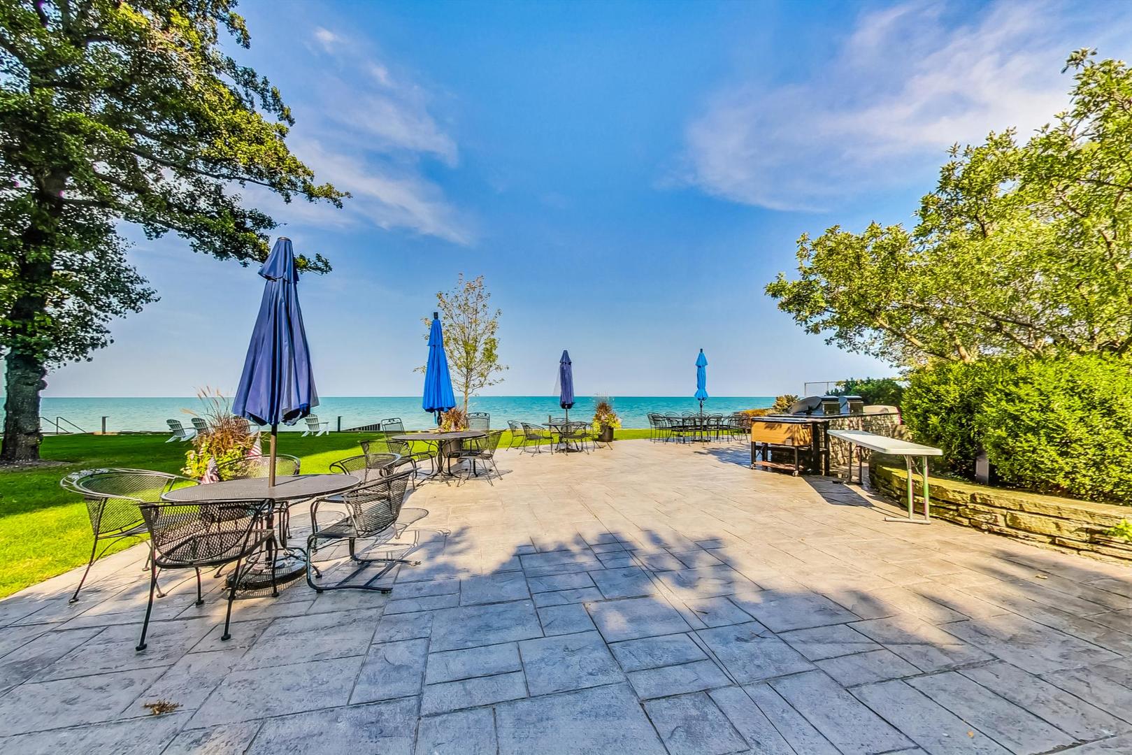 1630 Sheridan Road, Unit 8B Wilmette, IL 60091 - Photo 31 of 45 a view of a swimming pool with a lounge chairs