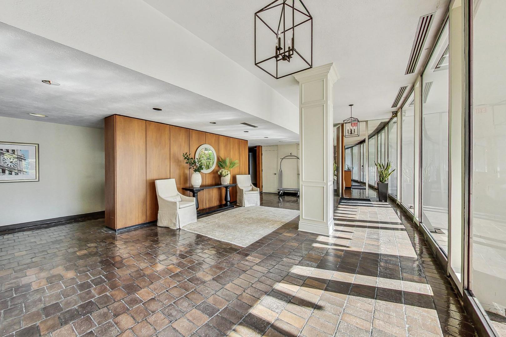 1630 Sheridan Road, Unit 8B Wilmette, IL 60091 - Photo 40 of 45 a view of a hallway with wooden floor and staircase