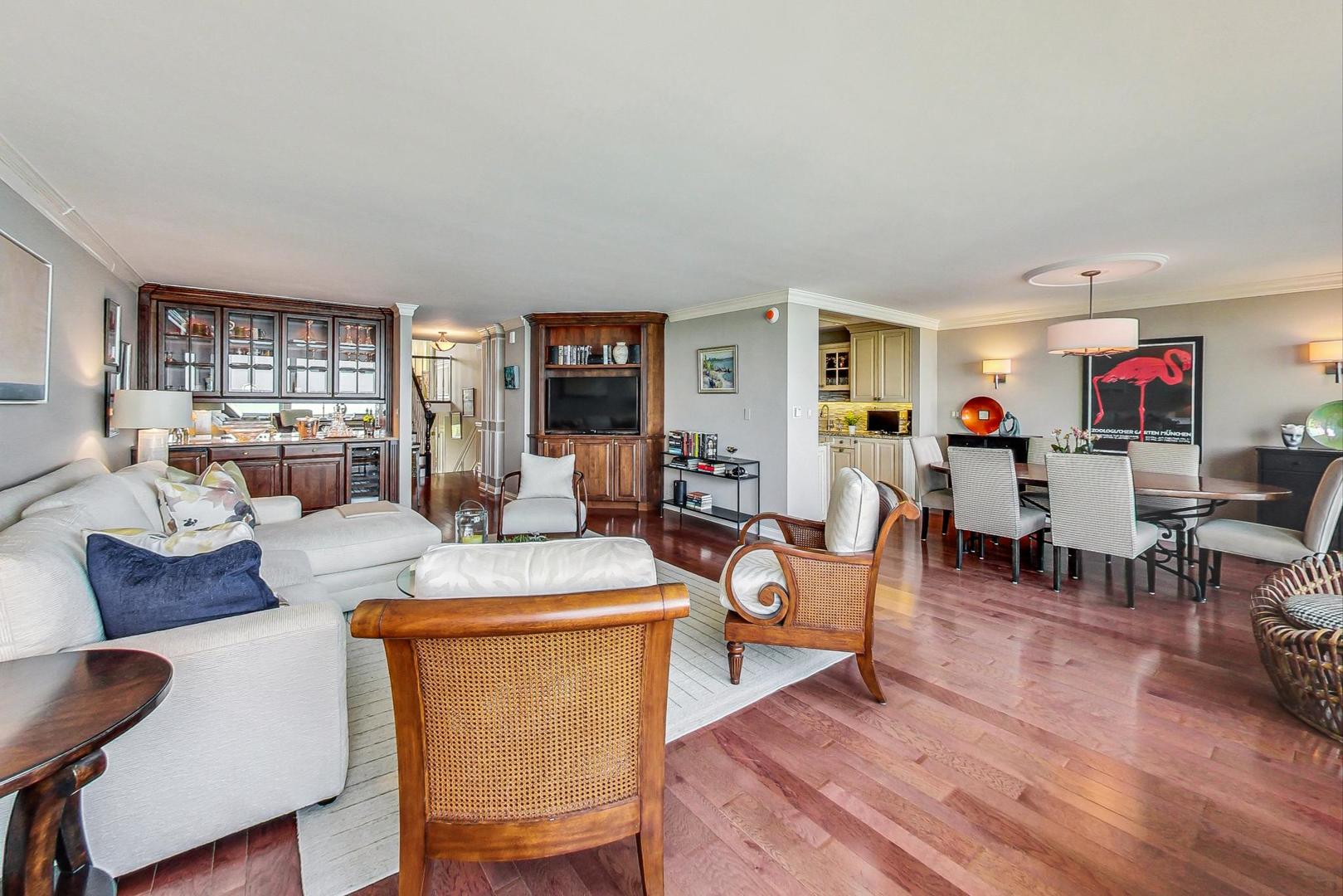 1630 Sheridan Road, Unit 8B Wilmette, IL 60091 - Photo 5 of 45 a living room with furniture and wooden floor
