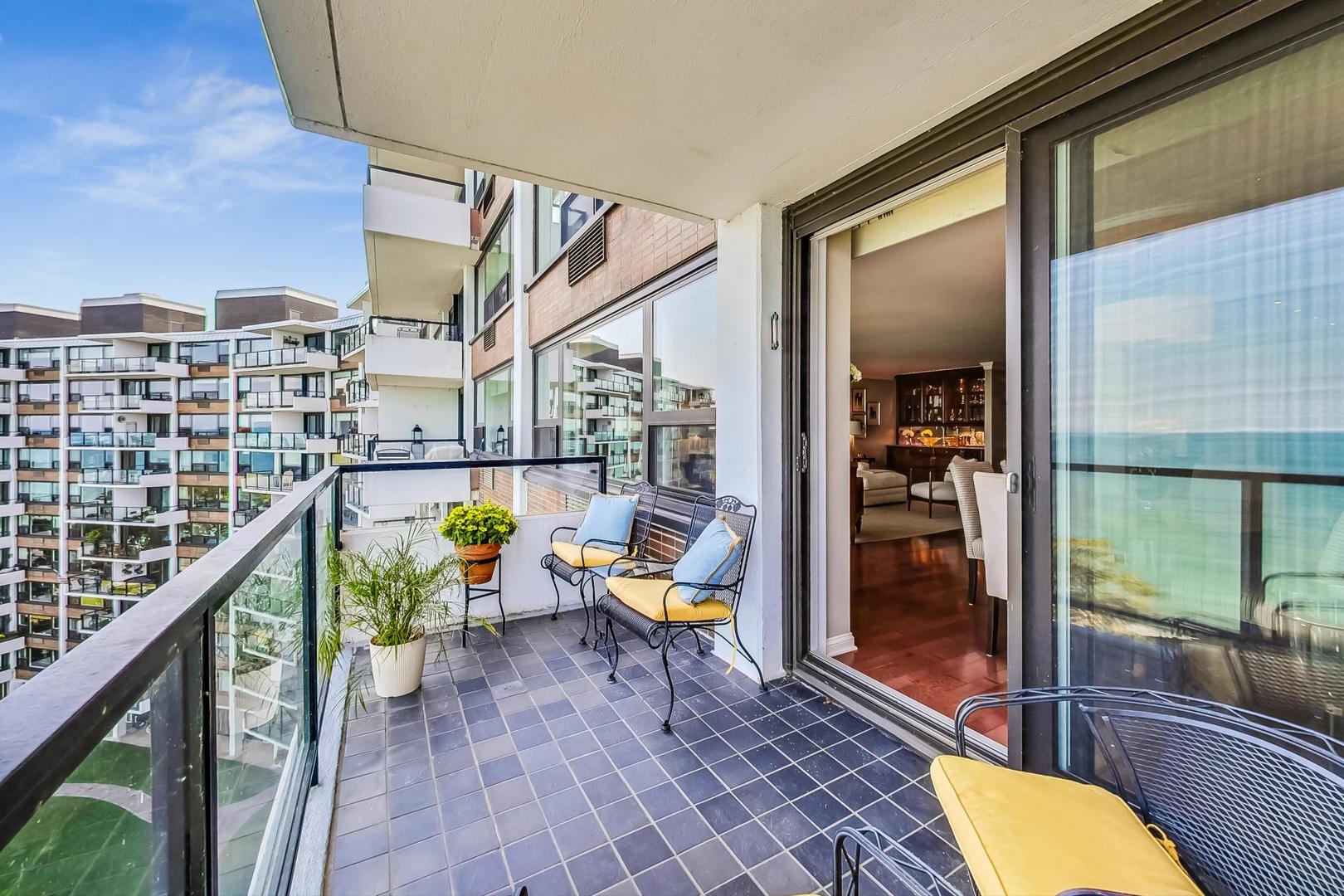 1630 Sheridan Road, Unit 8B Wilmette, IL 60091 - Photo 8 of 45 a balcony with furniture and wooden floor