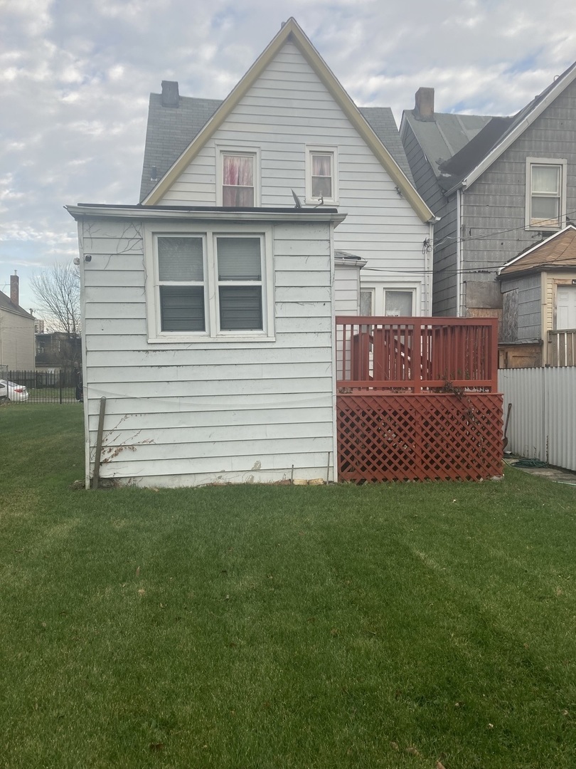 6528 South Sangamon Street Chicago, IL 60621 - Photo 3 of 6 a view of a house with a yard