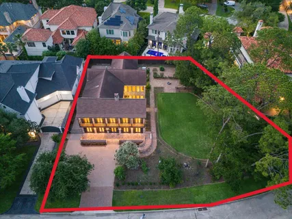 swimming pool view with plants and large trees