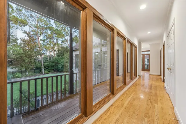 a view of a balcony with wooden floor