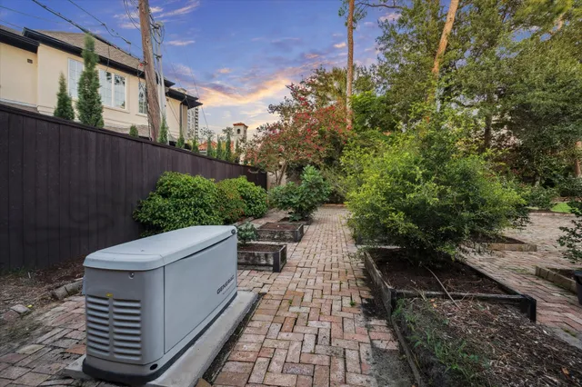 a view of a patio with couches and potted plants